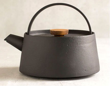 cast iron teapot on stove
